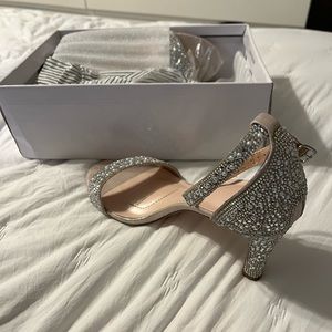 Brand new David’s Bridal shoes. Never worn outside, worn around the house once.